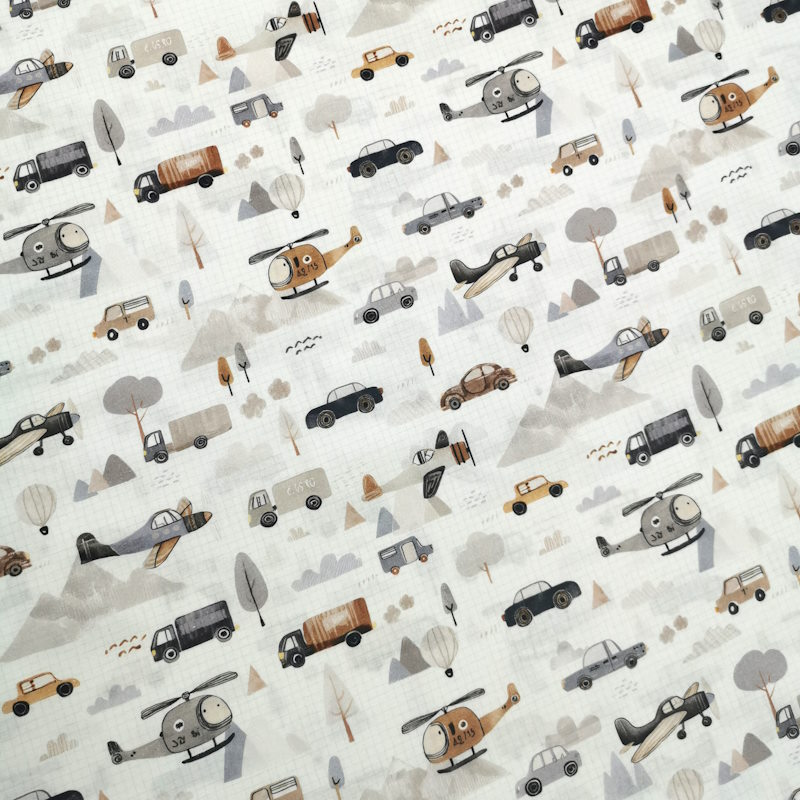 Hélicoptère tissu blanc avec un cadrillage comme une feuille de cahier, avec des motifs de camions; hélicoptère, voiture, montgolfière etc...