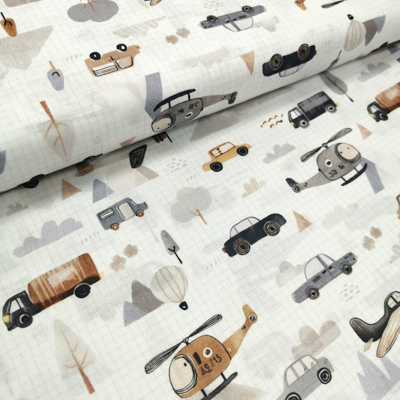 Hélicoptère tissu blanc avec un cadrillage comme une feuille de cahier, avec des motifs de camions; hélicoptère, voiture, montgolfière etc...