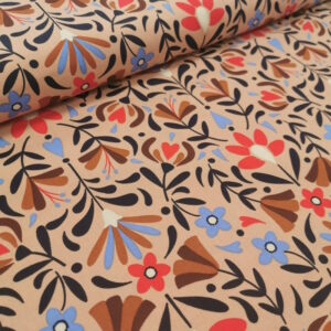 tissu à motifs de fleurs de différentes tailles dans un assemblage harmonieux