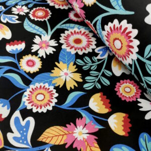 Tissu en coton noir avec des motifs de fleurs colorés